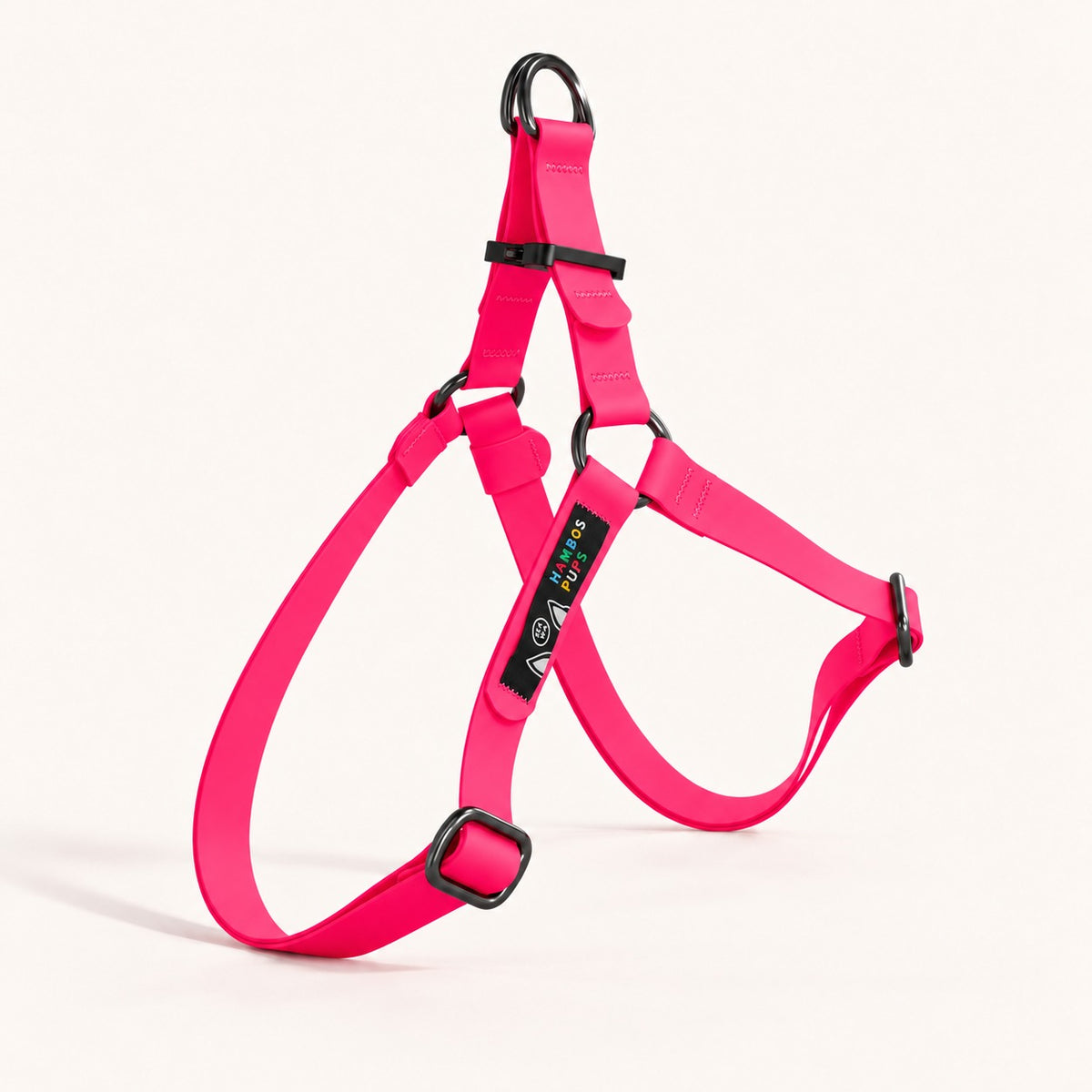 PNW Dry Harness in Max Pink Biothane with black hardware and the Hambos Pups label, studio shot